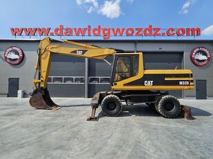 Caterpillar M320 excavadora de ruedas