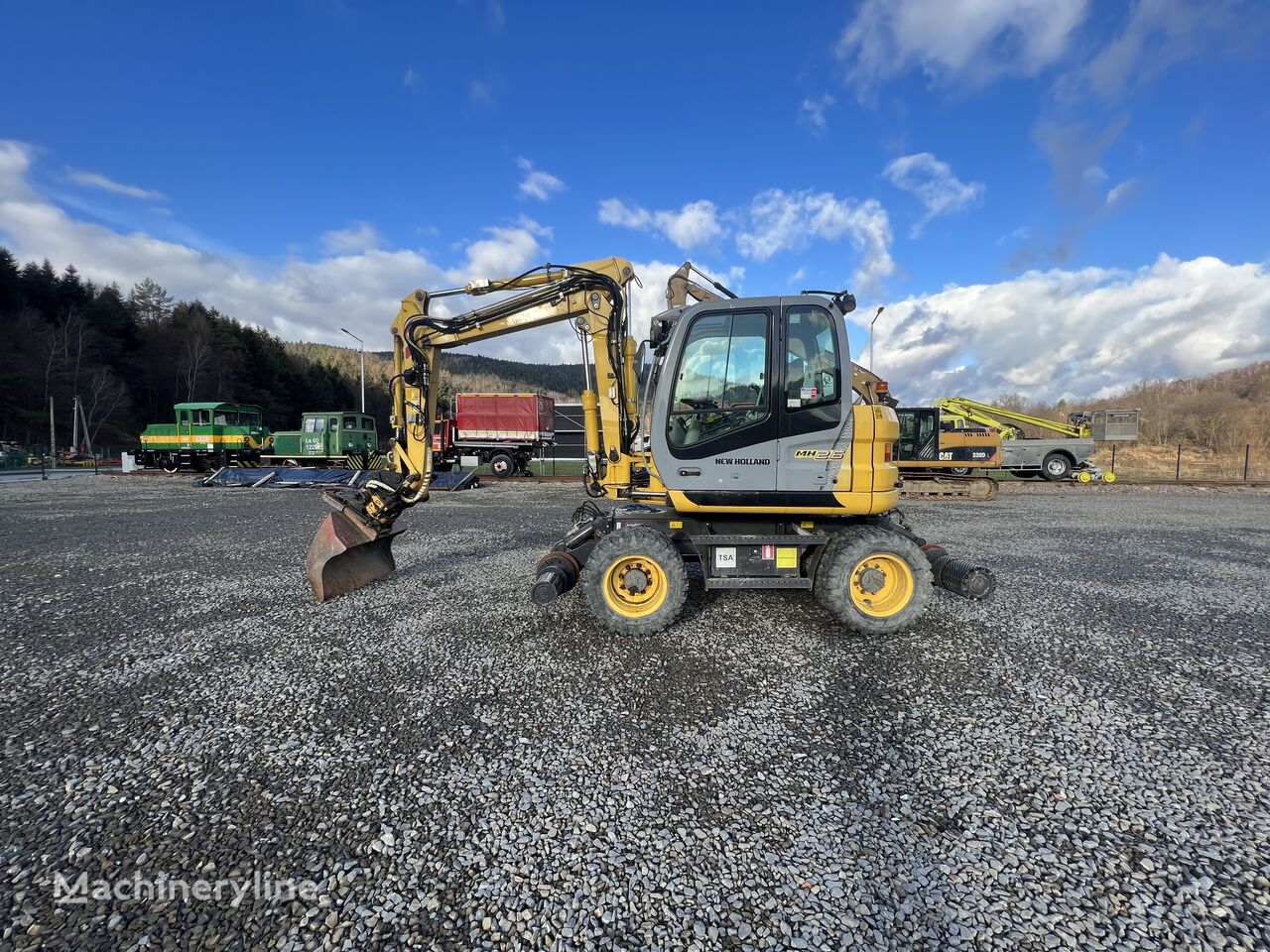 New Holland MH 2.6 excavadora rail